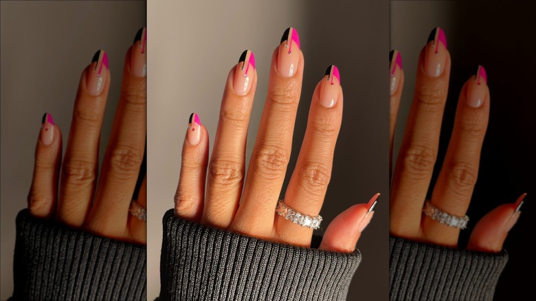 hand with black and pink french manicure