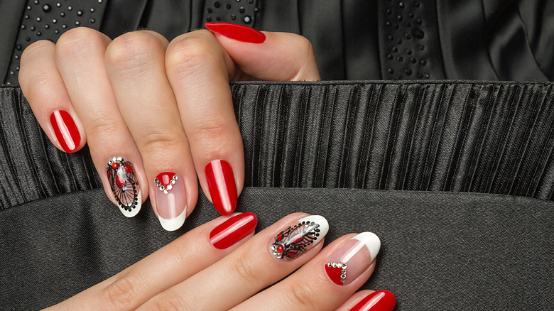 hand with white black red french manicure