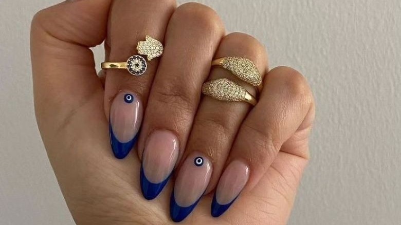 hands with dark blue french manicure