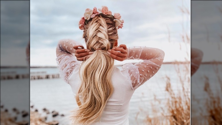 woman blonde hair braid flowers
