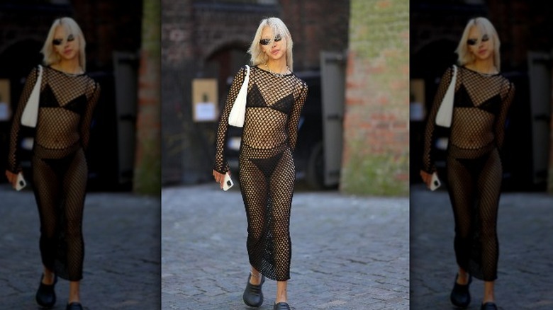 woman wearing fishnet dress