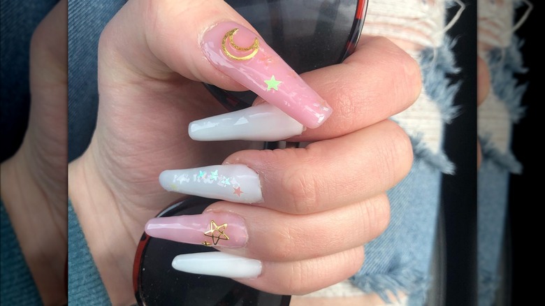 hand with celestial coffin nails