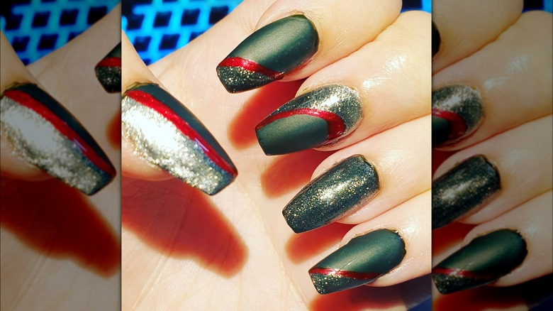 hand with matte and glitter coffin nails