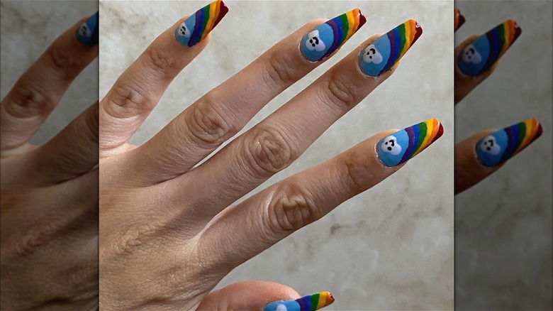 hand with rainbow coffin nails