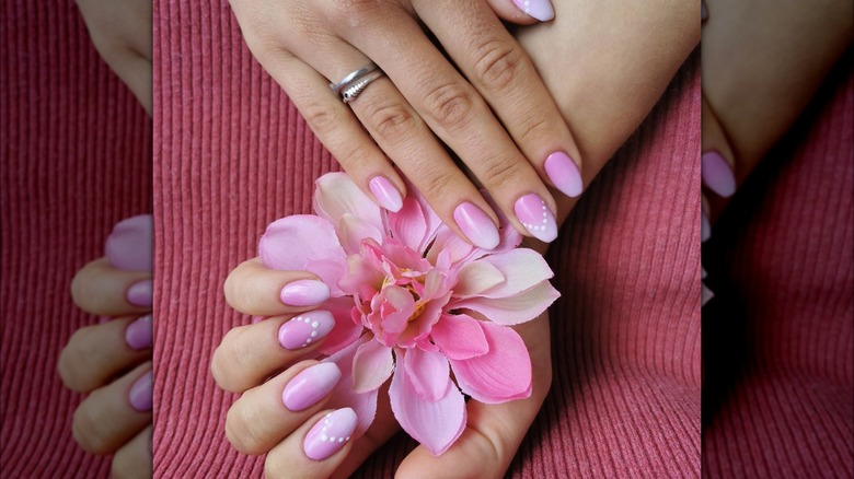 hands with pink ombre polka dot coffin nails