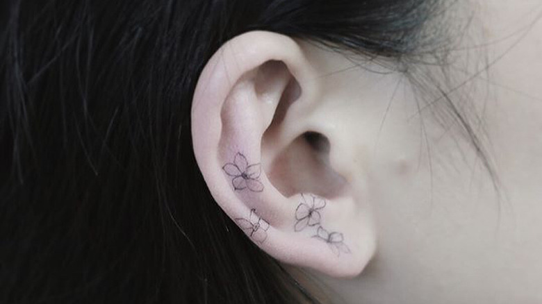 floral ear tattoo