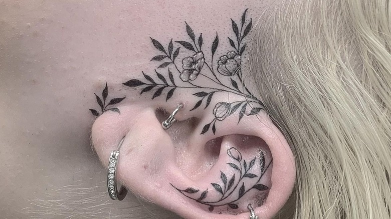 flowers and vines ear tattoo