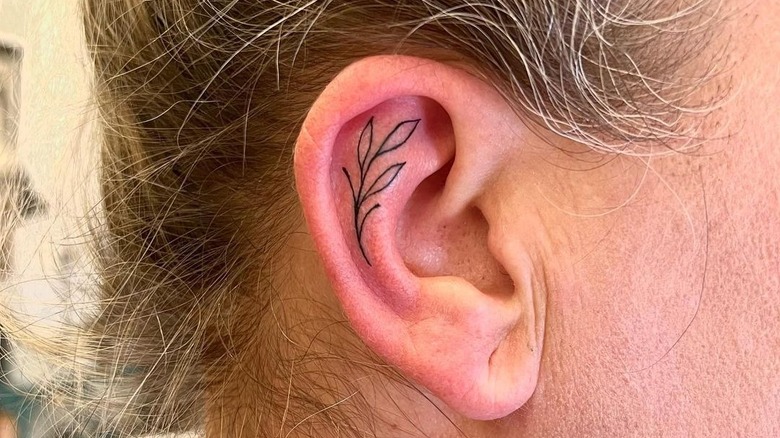 ear tattoo of leaves