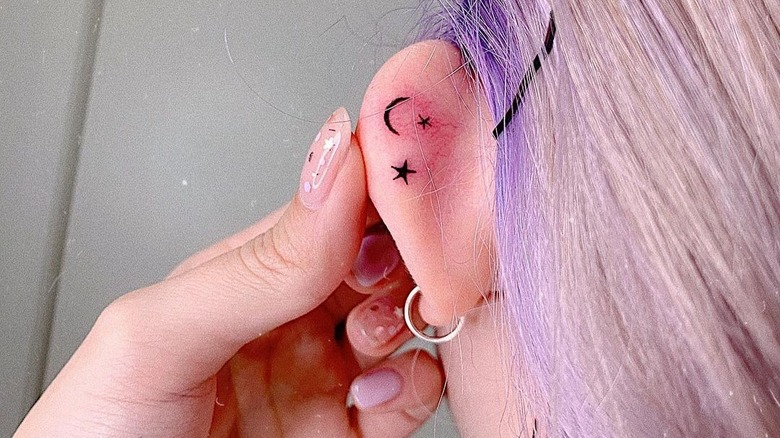 moon and stars ear tattoo