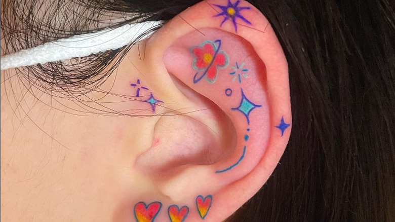 colorful ear tattoo