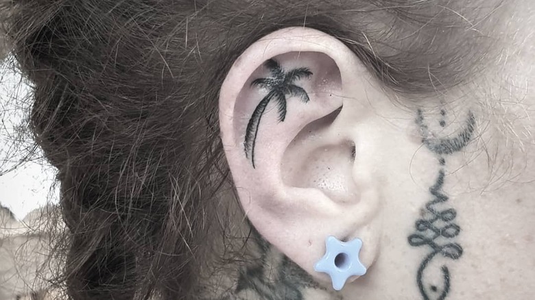 palm tree ear tattoo