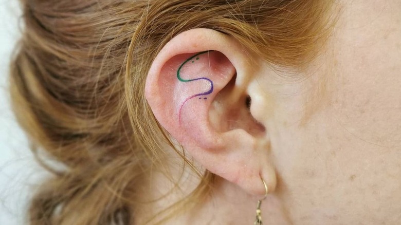 colorful swirl ear tattoo