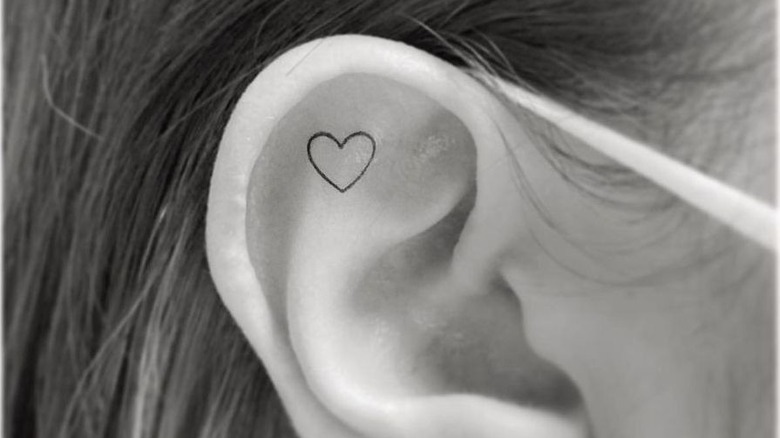 tiny heart ear tattoo