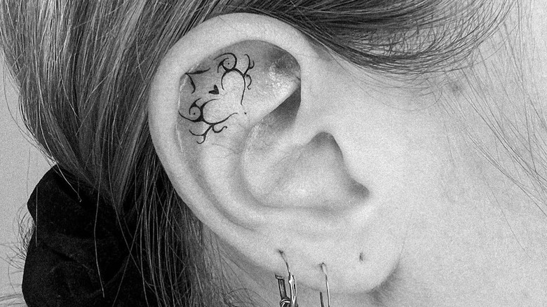 tribal heart ear tattoo