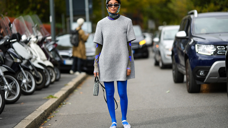 Woman wearing mini dress bold tights