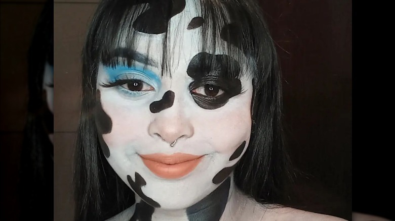 Woman wearing cow makeup