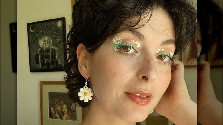 Woman wearing flower child makeup