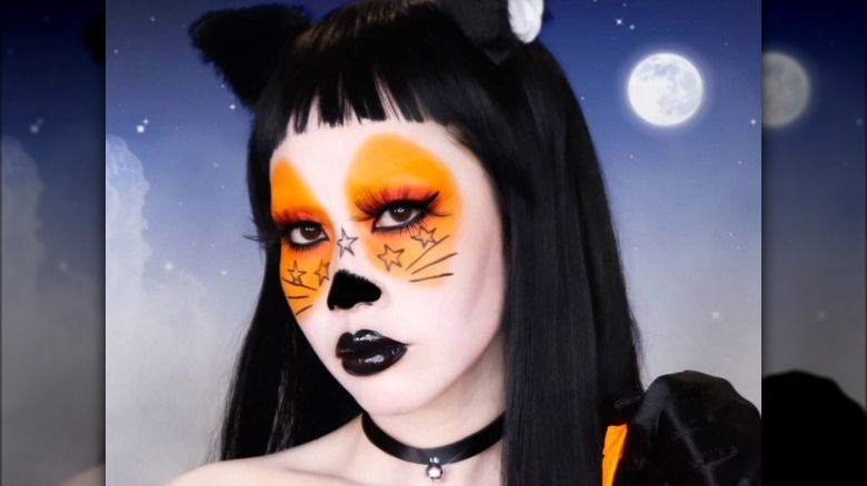 Woman wearing Halloween cat makeup