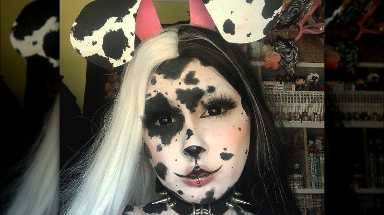 Woman wearing Dalmatian puppy makeup