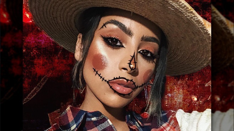 Woman wearing scarecrow makeup