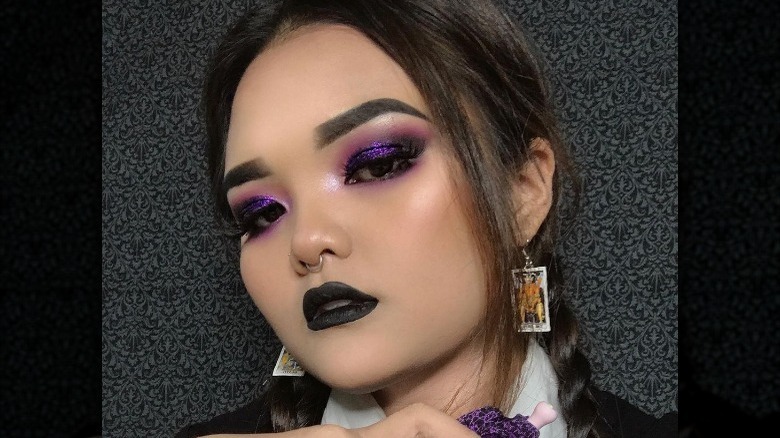 Woman wearing Wednesday Addams makeup