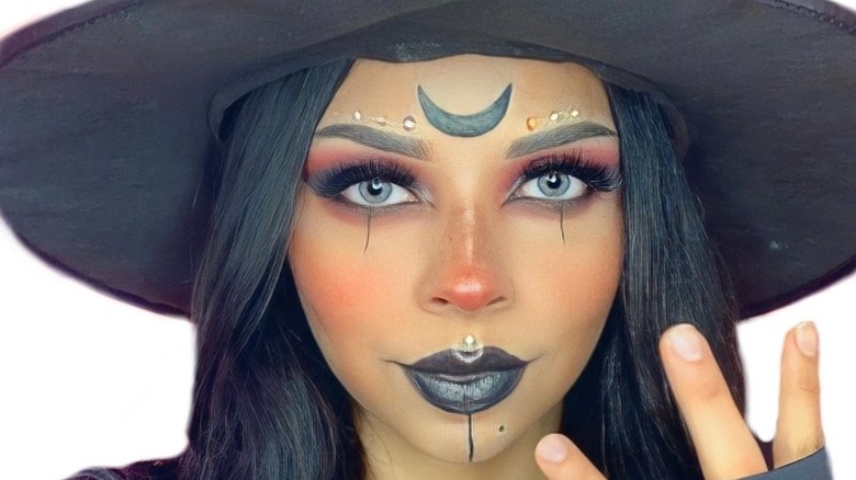 Woman wearing witch makeup