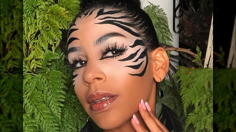 Woman wearing zebra makeup