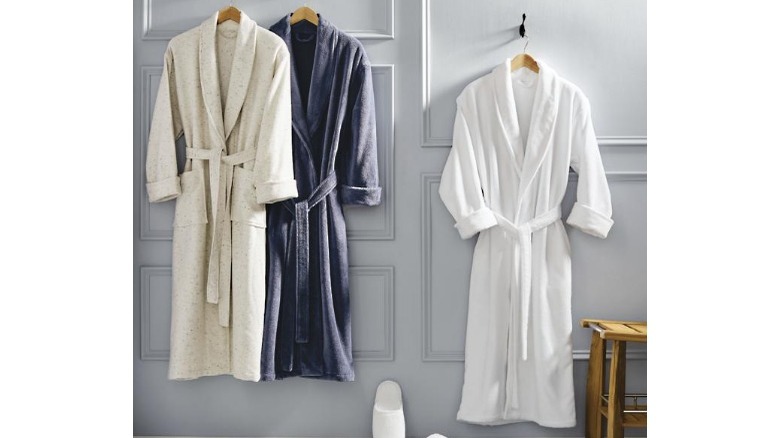 robes hanging on wood hangers