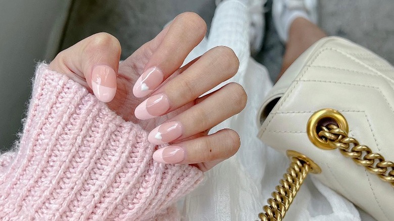 Pink French manicure with hearts