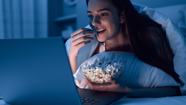 woman watching movie on her computer