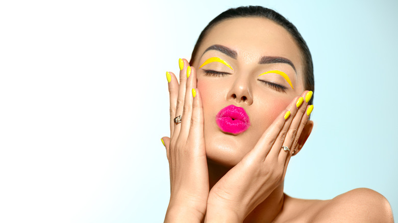 woman with fun yellow makeup