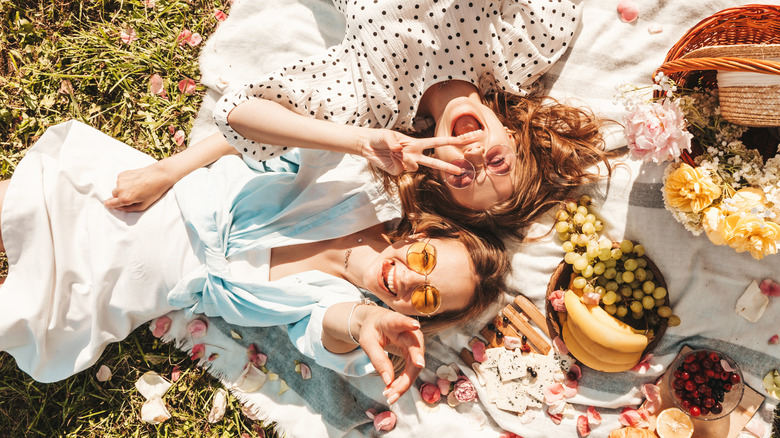 two friends posing during a picnic
