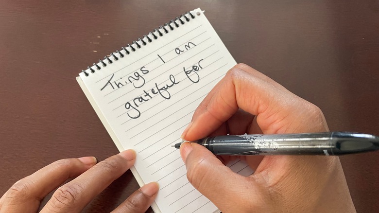 person making gratitude list