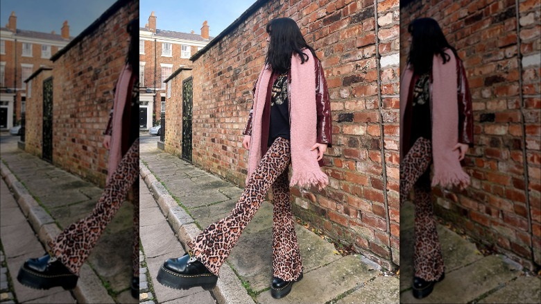 Woman wearing leopard print pants and Dr Martens
