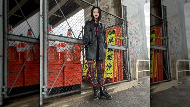 Woman in plaid pants and Dr Marten boots