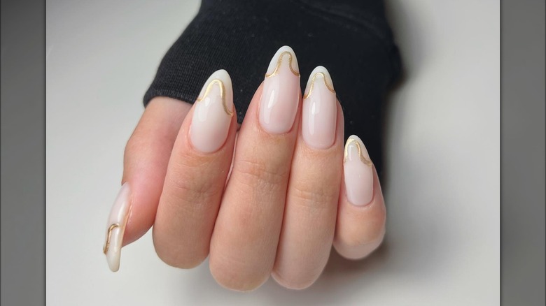 gold detail manicure