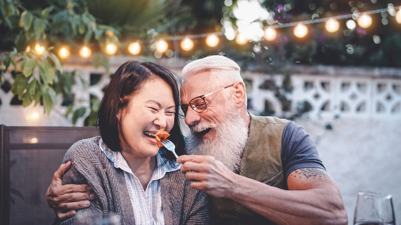 couple eating outside on patio