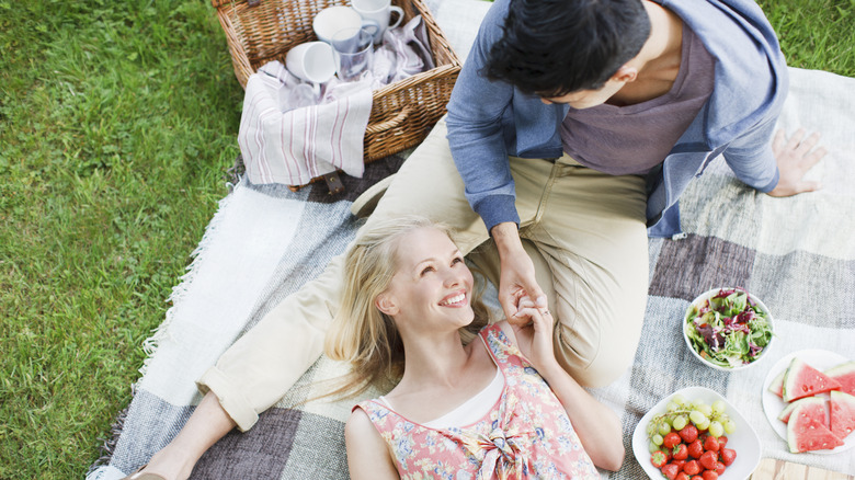 couple having outdoor picnic