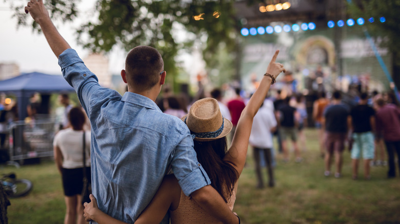 couple outside at concert together