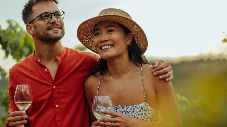 couple drinking wine at winery