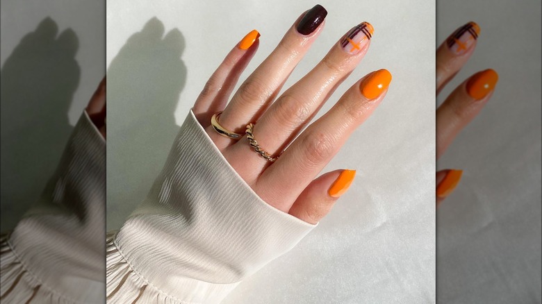 Orange and purple checkered manicure