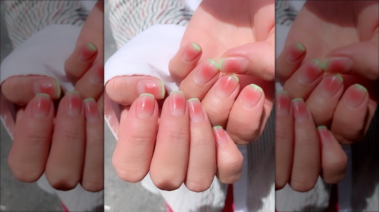 Blush manicure with green tips