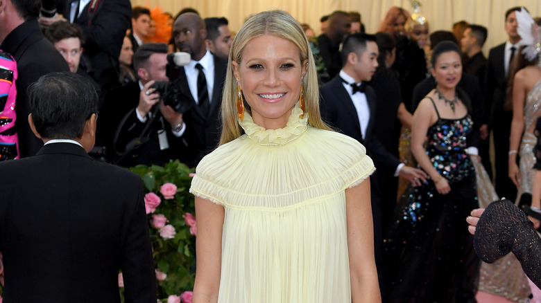 Gwyneth Paltrow in yellow gown, smiling