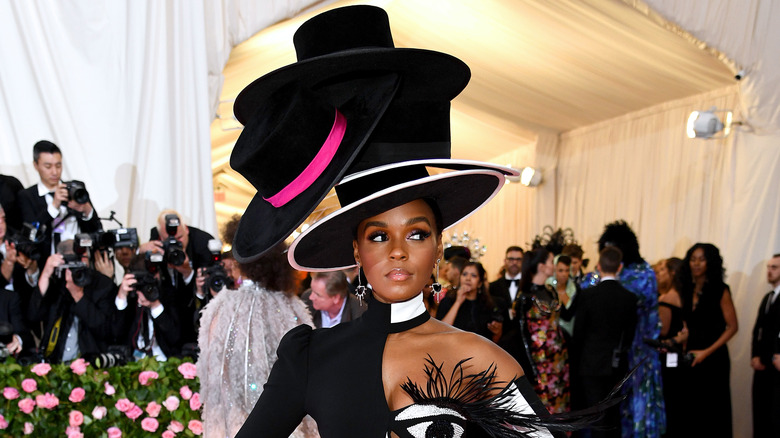 Janelle Monáe with large hat at gala