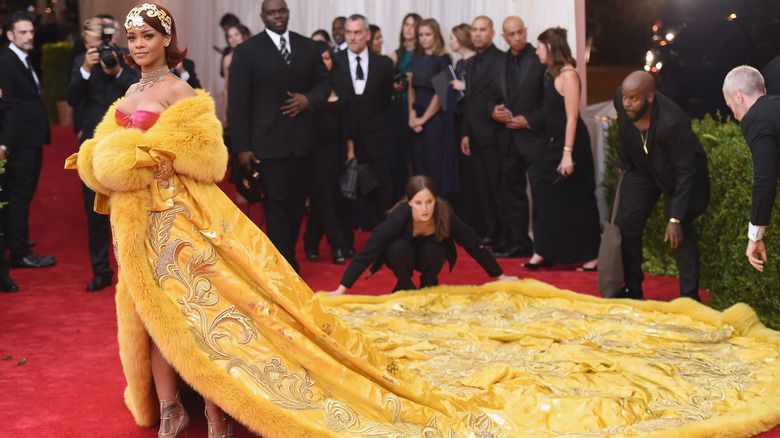 Rihanna wearing pink, yellow gown