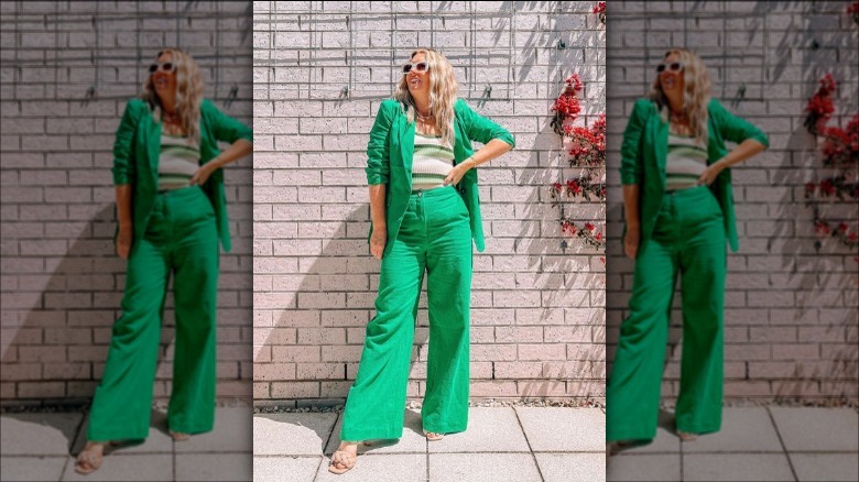 Woman wearing a green pantsuit