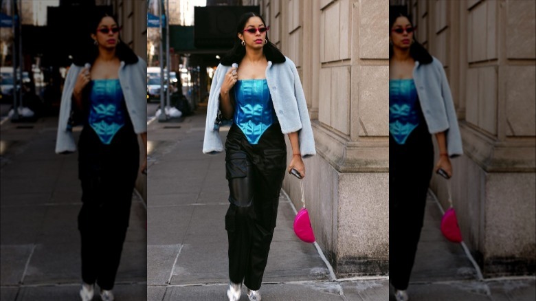 Woman wearing metallic blue corset