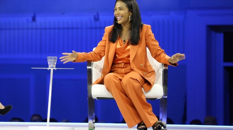 Kim Posnett in monochromatic suit