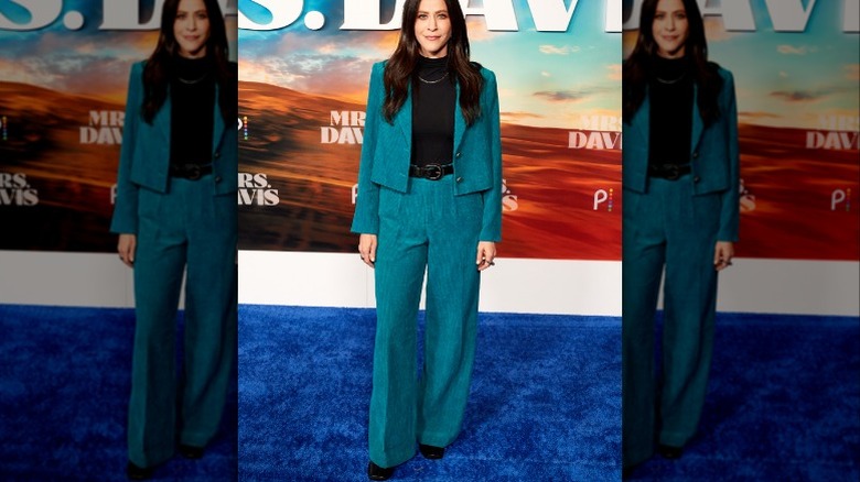 Jackie Tohn in teal suit