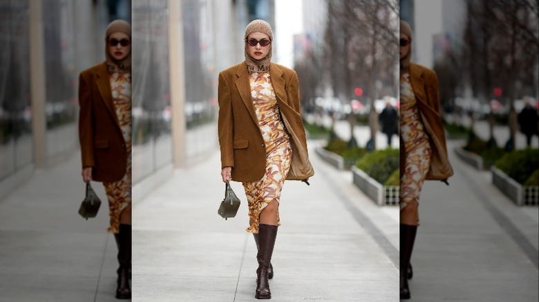 Woman wearing blazer and dress